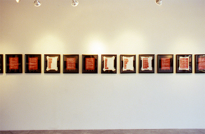 2002 11 08 Indian Acts Indian Act Nadia Myre Beaded exhibition roll 2 019 installation shot showing west wall row of framed images