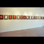 Indian Acts Nadia Myre installation shot showing east wall row of framed images