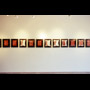 Indian Acts Nadia Myre installation shot showing west wall row of framed images