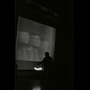 Rebecca Belmore performs swinging a light