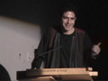 Greg Hill at podium